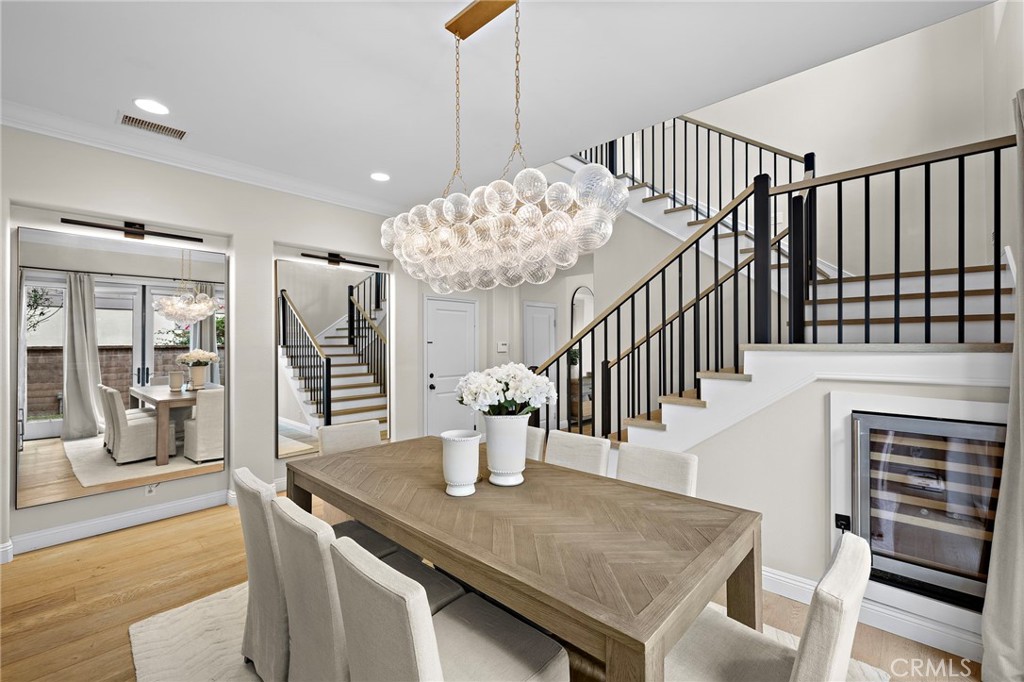 7 Julia Street Ladera Ranch, CA 92694 - Photo 10 of 52 a view of a dining room and hall with wooden floor