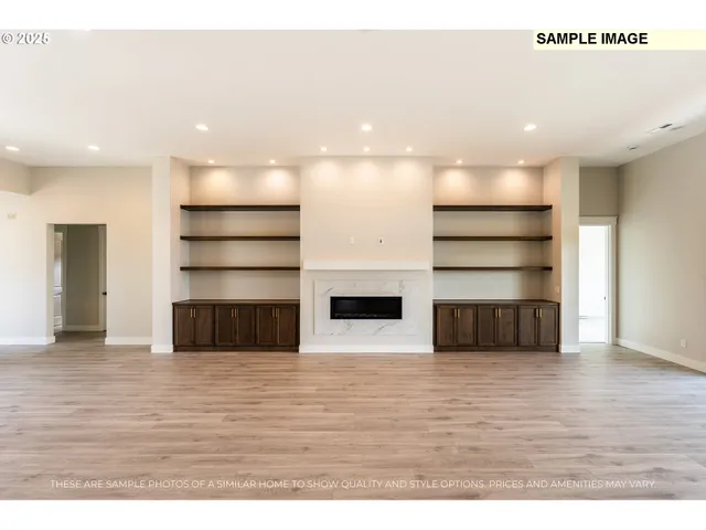 a view of a living room with wooden floor