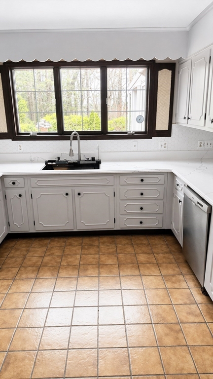 12 Woodland Road Westfield, MA 01085 - Photo 14 of 29 a kitchen with a sink a stove and cabinets