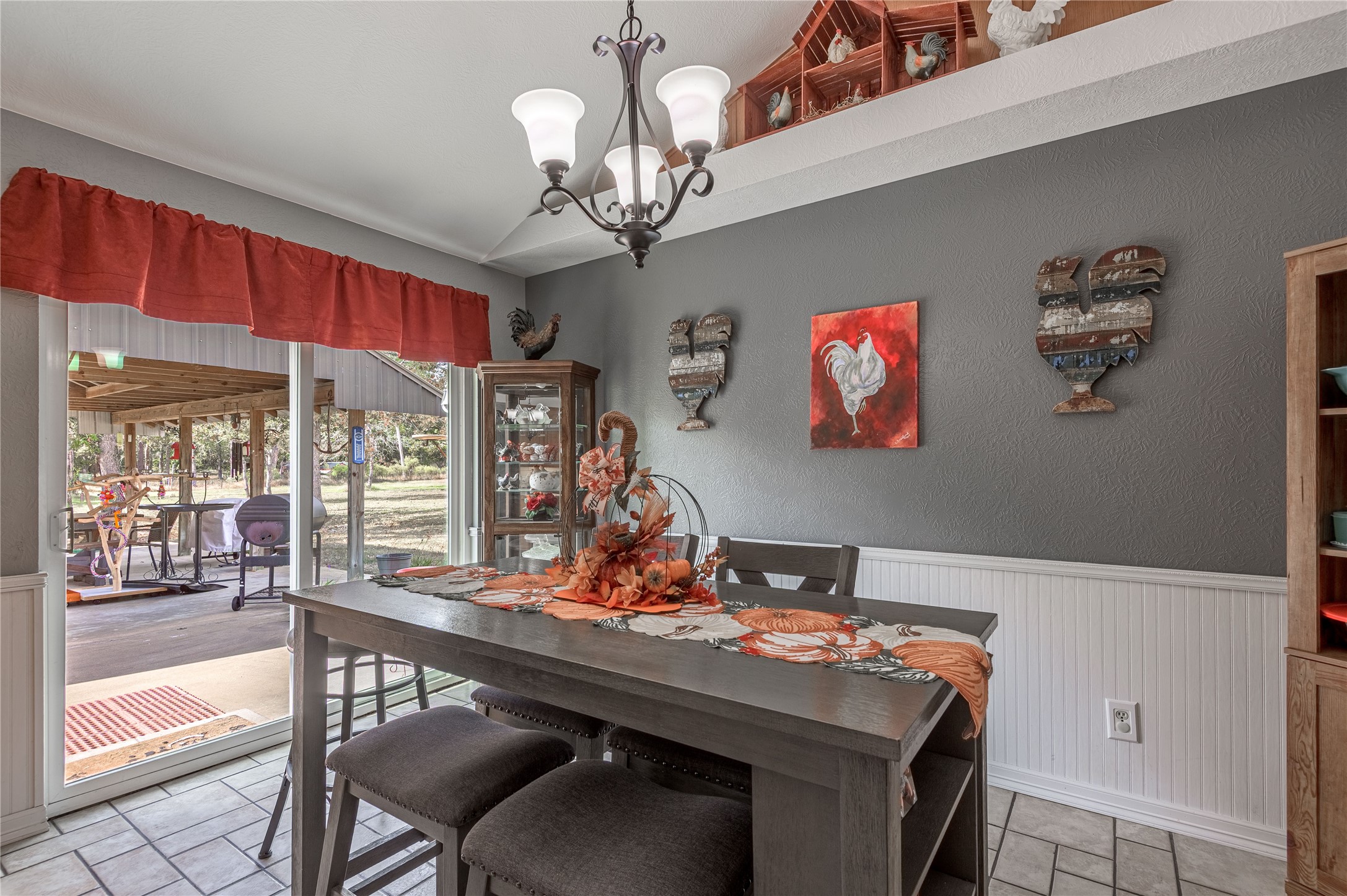 70 William Thomas Road Huntsville, TX 77320 - Photo 12 of 50 a view of a dining room with furniture wooden floor and chandelier