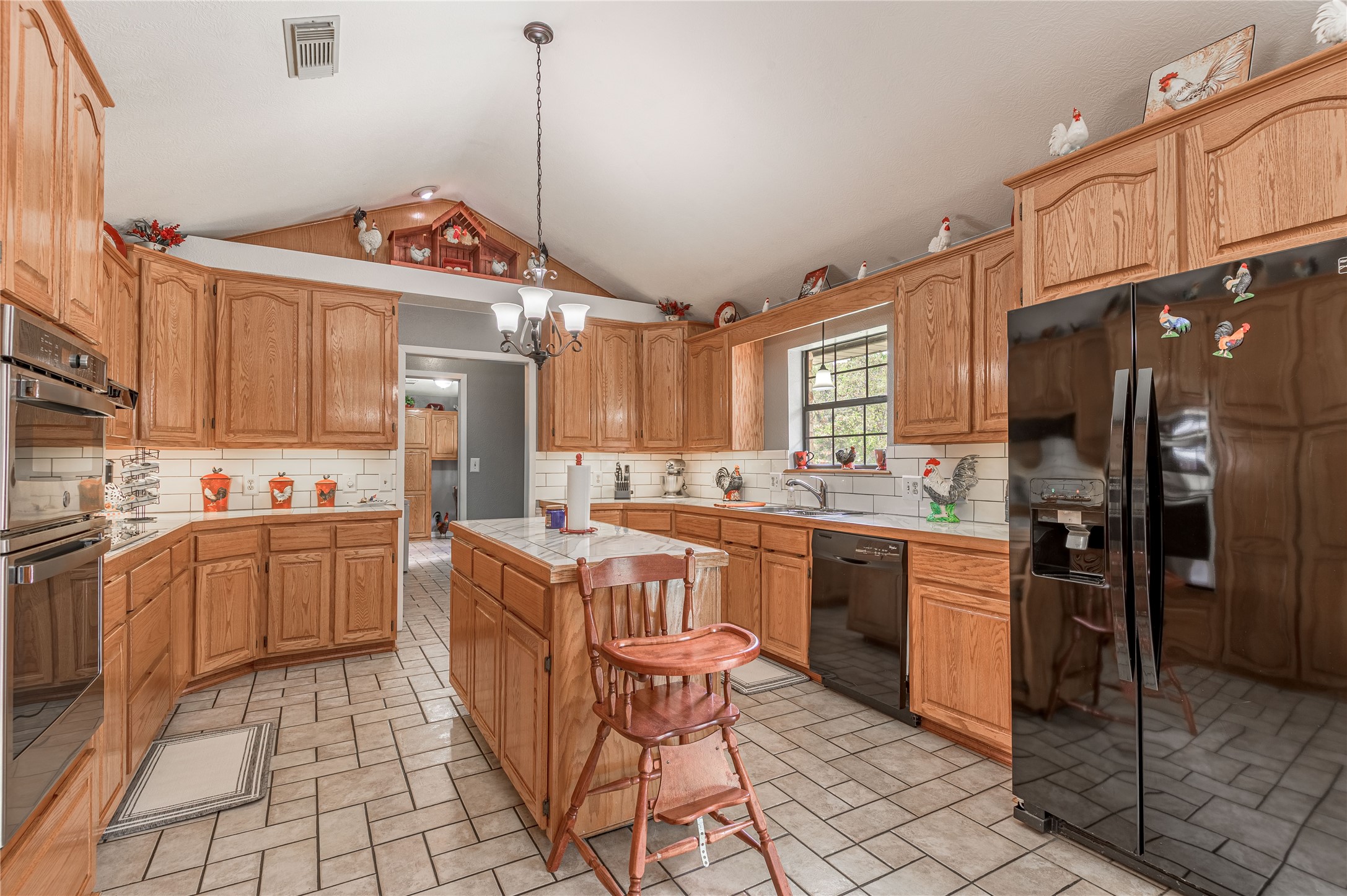 70 William Thomas Road Huntsville, TX 77320 - Photo 13 of 50 a kitchen with a sink stove and cabinets