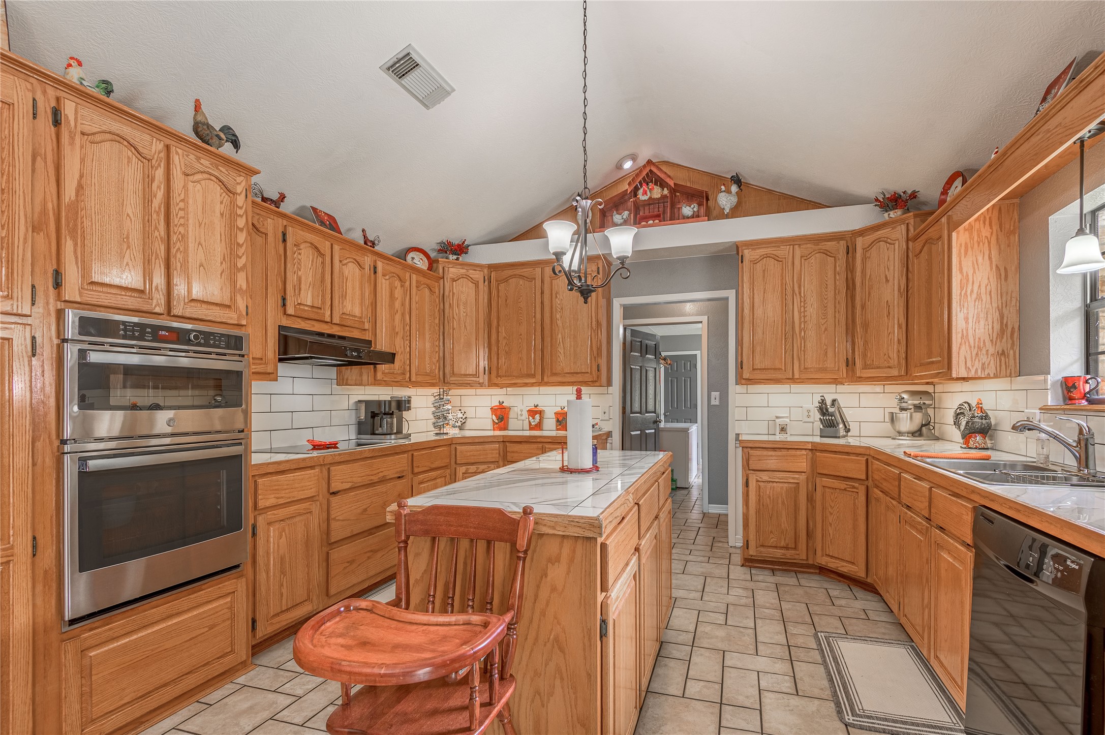 70 William Thomas Road Huntsville, TX 77320 - Photo 14 of 50 a kitchen with stainless steel appliances a stove sink and cabinets