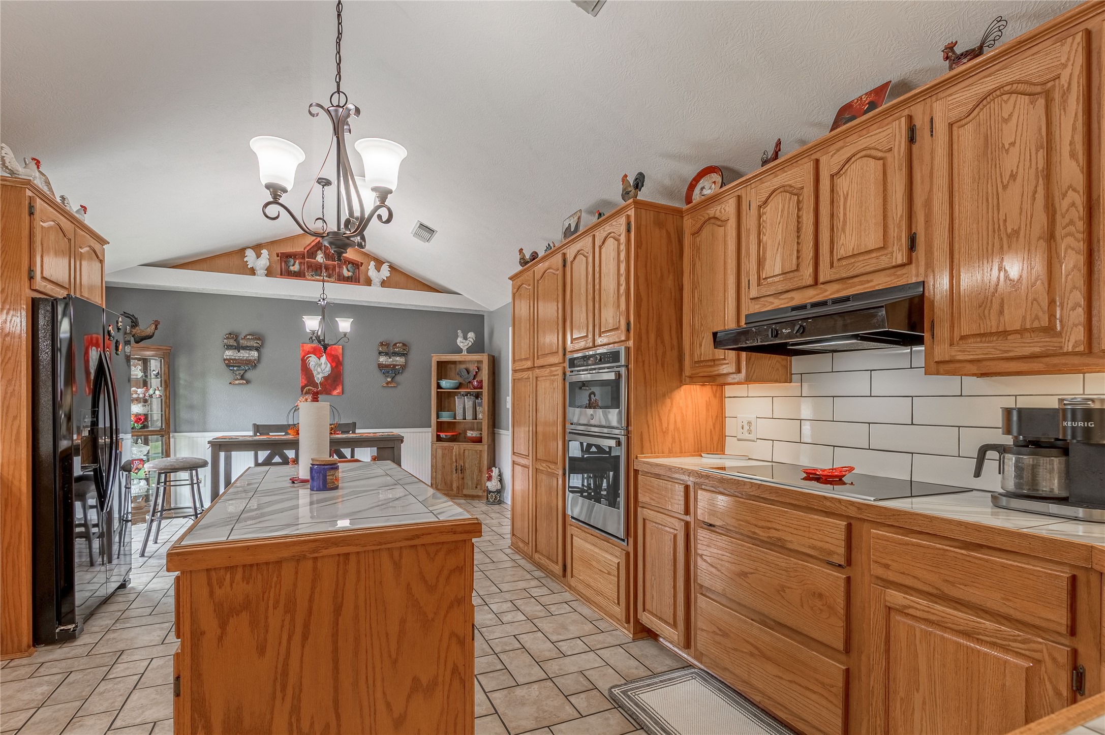 70 William Thomas Road Huntsville, TX 77320 - Photo 15 of 50 a kitchen with stainless steel appliances granite countertop a refrigerator a oven and a sink with large cabinets