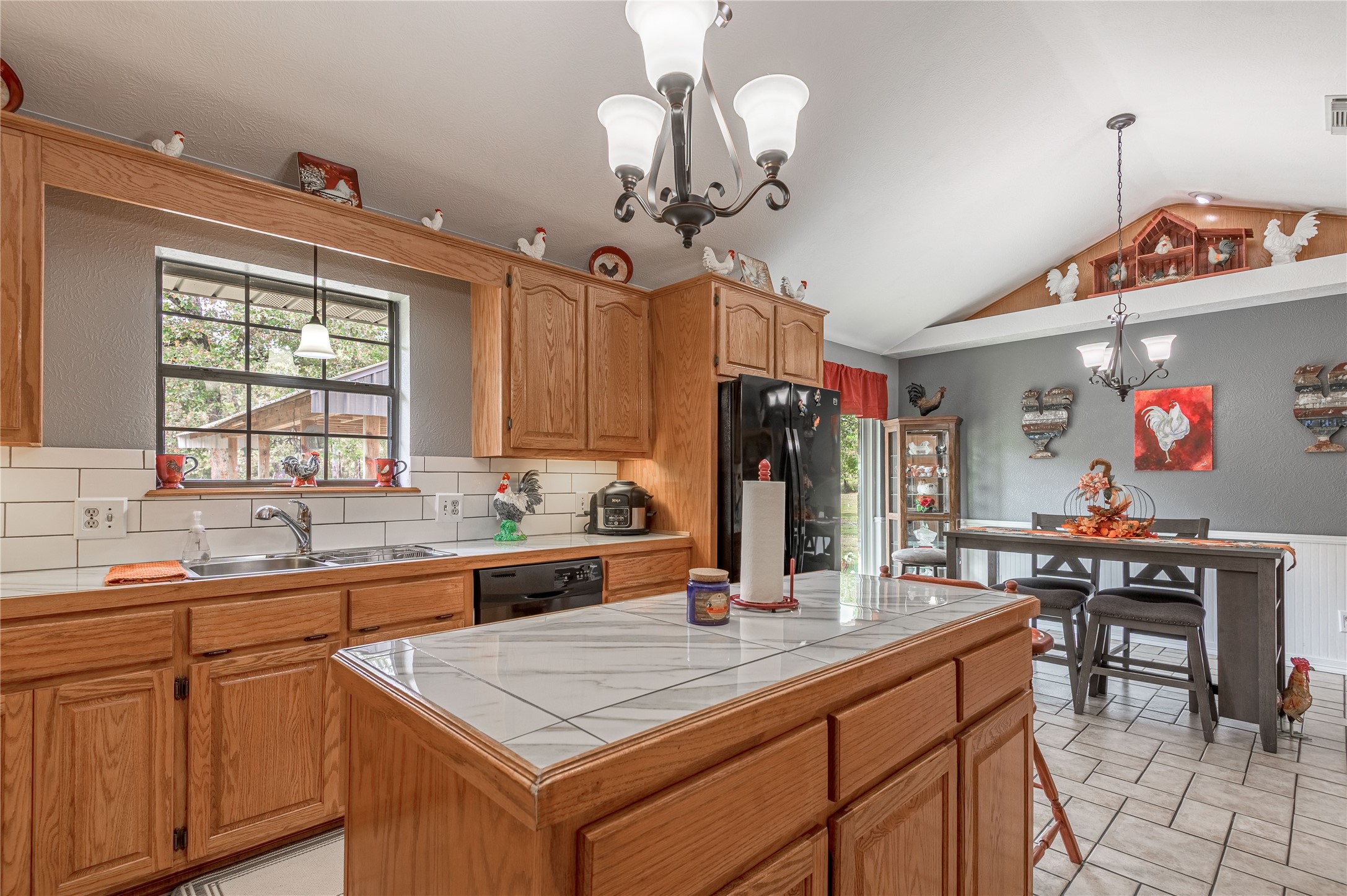 70 William Thomas Road Huntsville, TX 77320 - Photo 16 of 50 a kitchen that has a lot of cabinets in it