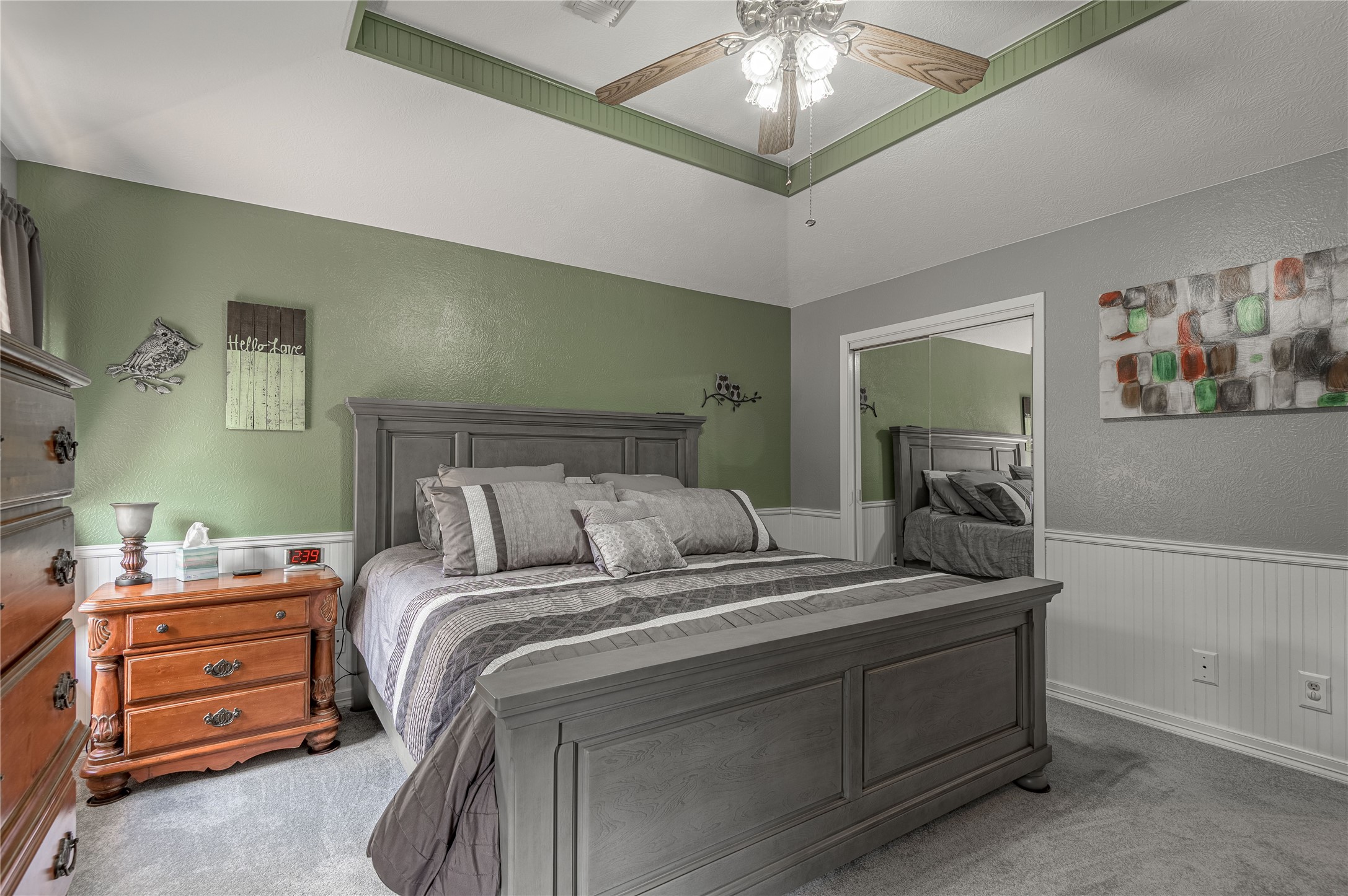 70 William Thomas Road Huntsville, TX 77320 - Photo 21 of 50 a bedroom with a bed and a chandelier