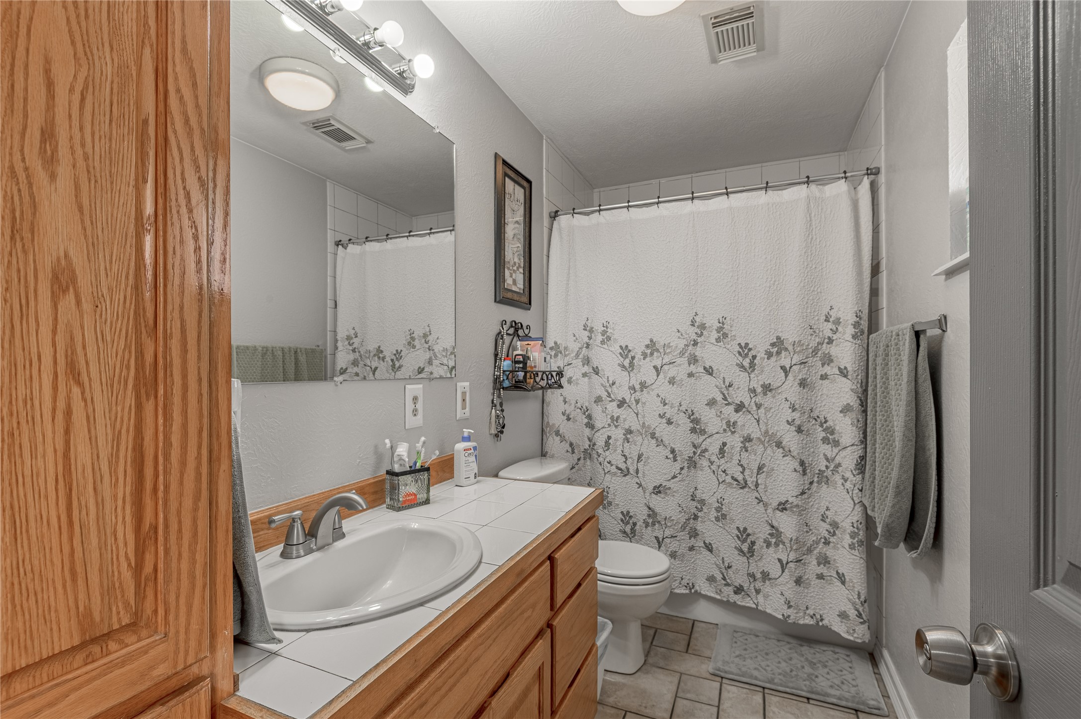 70 William Thomas Road Huntsville, TX 77320 - Photo 22 of 50 a bathroom with a sink toilet and shower