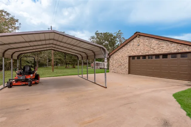 a view of a house with backyard and porch