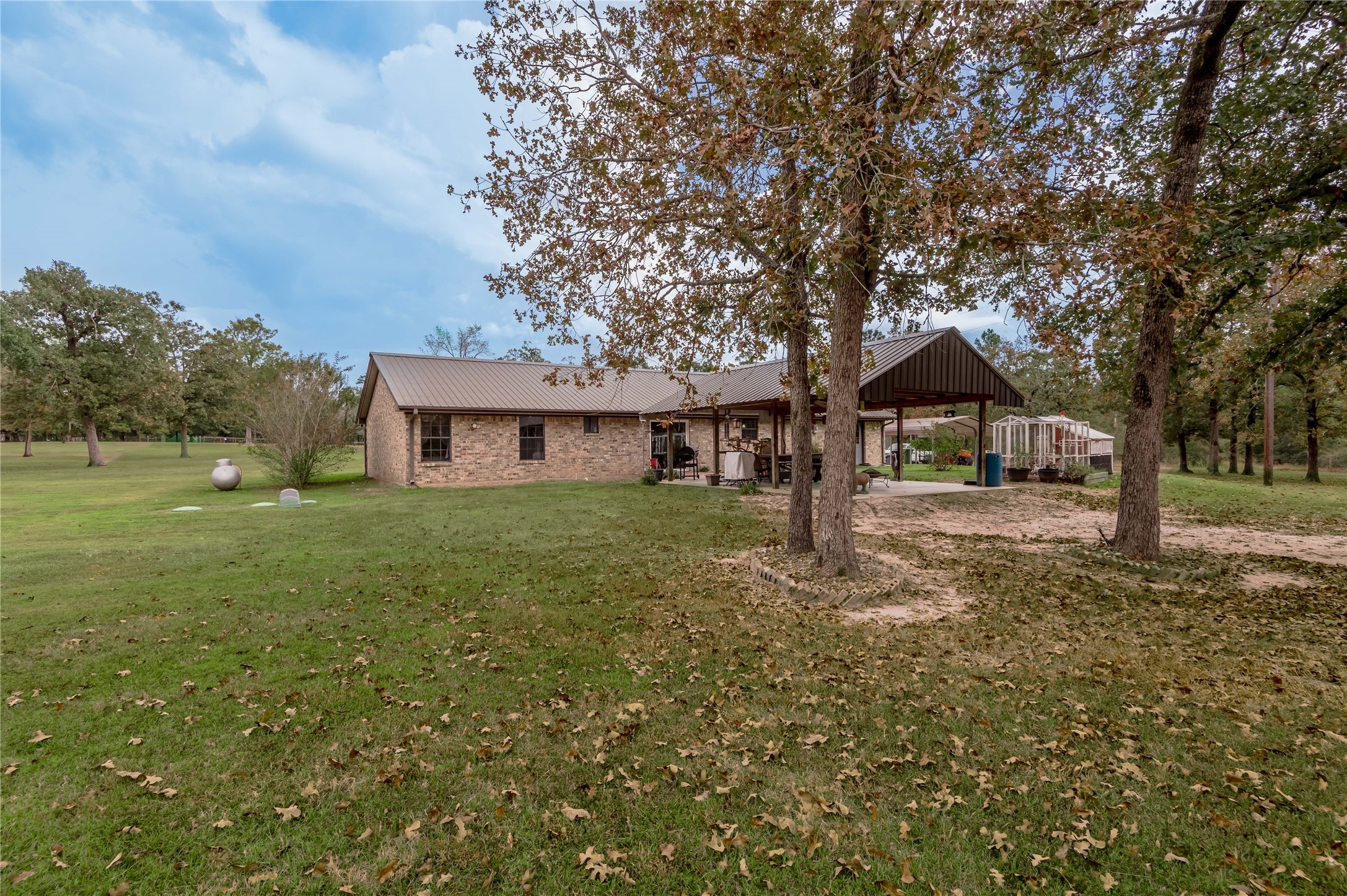 70 William Thomas Road Huntsville, TX 77320 - Photo 39 of 50 a front view of a house with garden