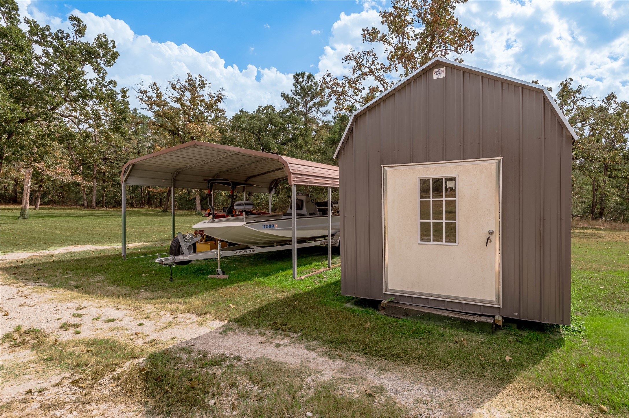70 William Thomas Road Huntsville, TX 77320 - Photo 43 of 50 a view of a house with backyard and sitting area