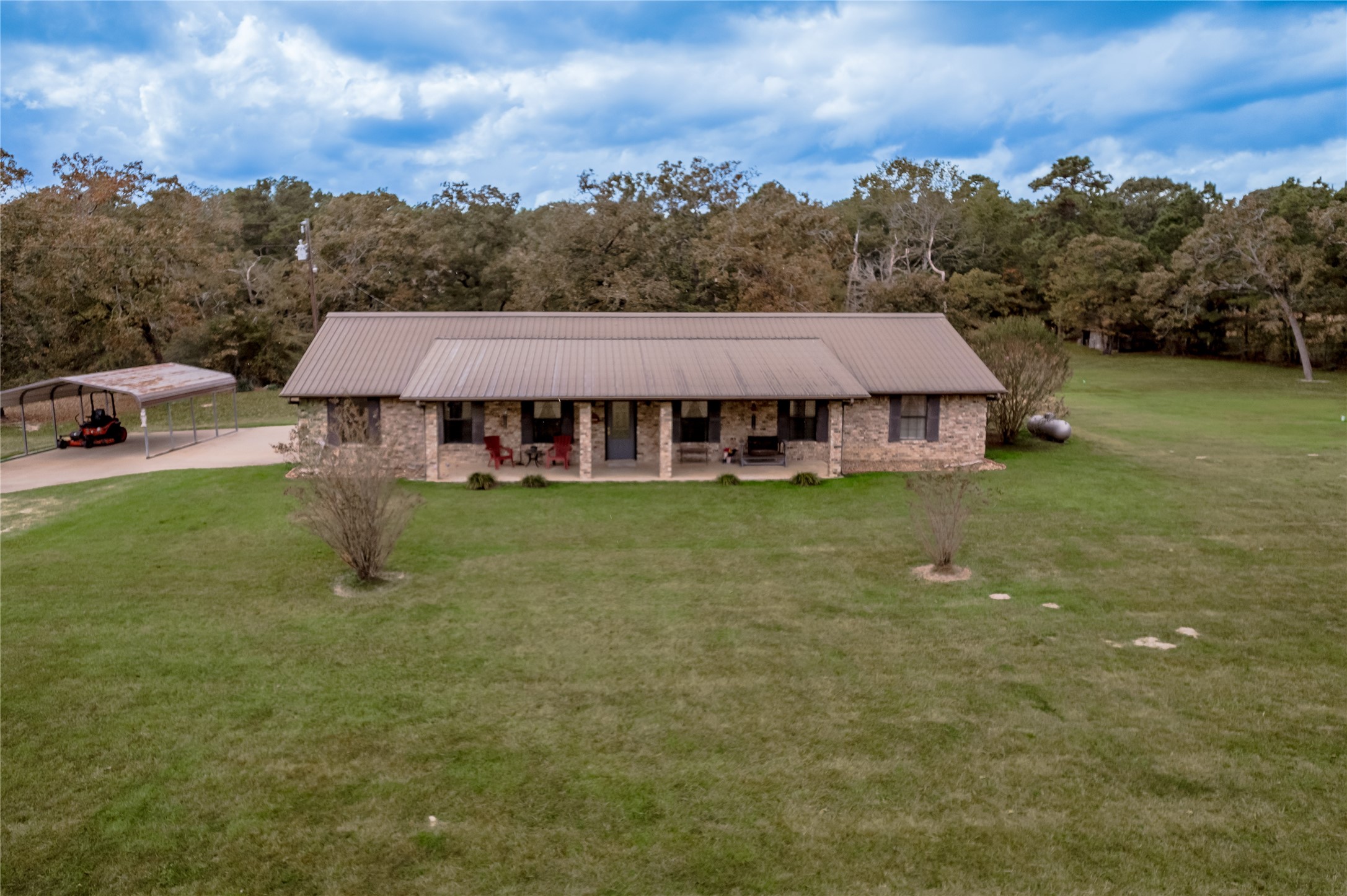 70 William Thomas Road Huntsville, TX 77320 - Photo 50 of 50 a aerial view of a house with swimming pool garden view and trees