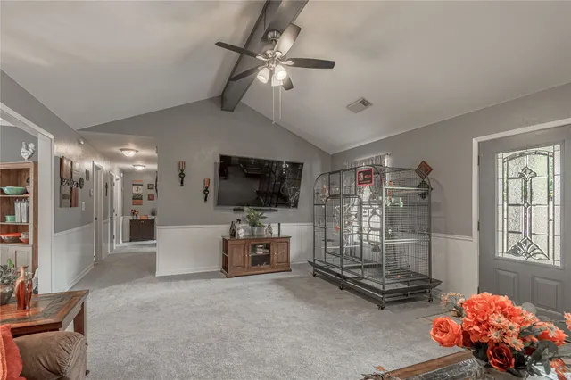 a view of a dining room with furniture wooden floor and chandelier