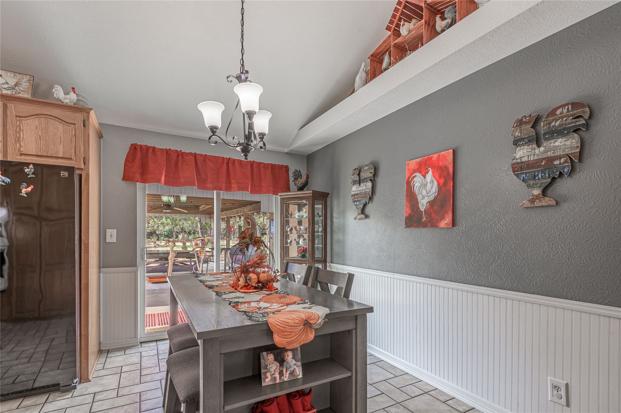 70 William Thomas Road Huntsville, TX 77320 - Photo 9 of 50 a view of a dining room with furniture wooden floor and chandelier