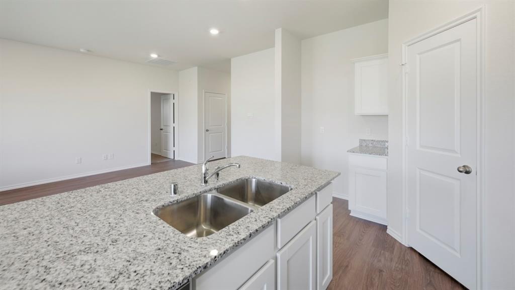 4101 Oakcrest Lane Princeton, TX 75407 - Photo 21 of 26 a kitchen with a sink and cabinets