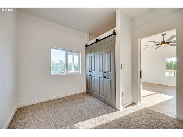 a view interior of a house with wooden floor windows and entryway