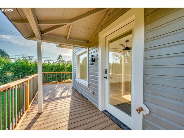 a view of a balcony with wooden floor