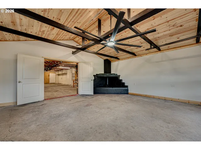a view of a garage with wooden stairs