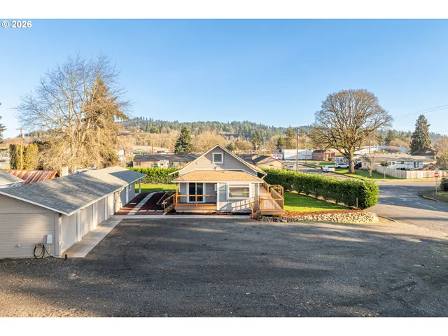 a view of houses with outdoor space and lakeside
