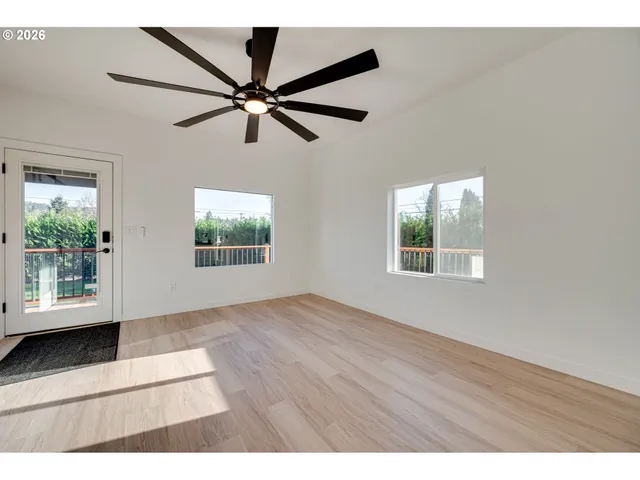 a view of an empty room with a window