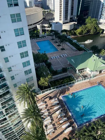 a view of a backyard with plants and a patio