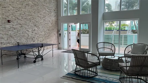 a view of a chairs and table in patio