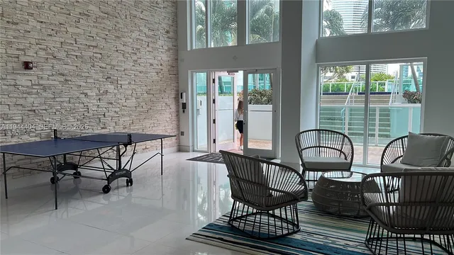 a view of a chairs and table in patio