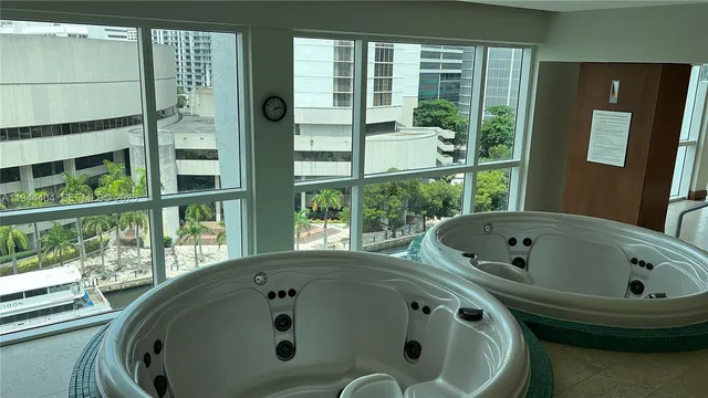 a bathroom with a tub and a window