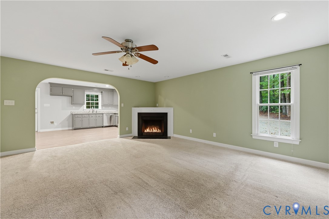 5369 Old Buckingham Road Powhatan, VA 23139 - Photo 11 of 28 Living area featuring a fireplace with a white man