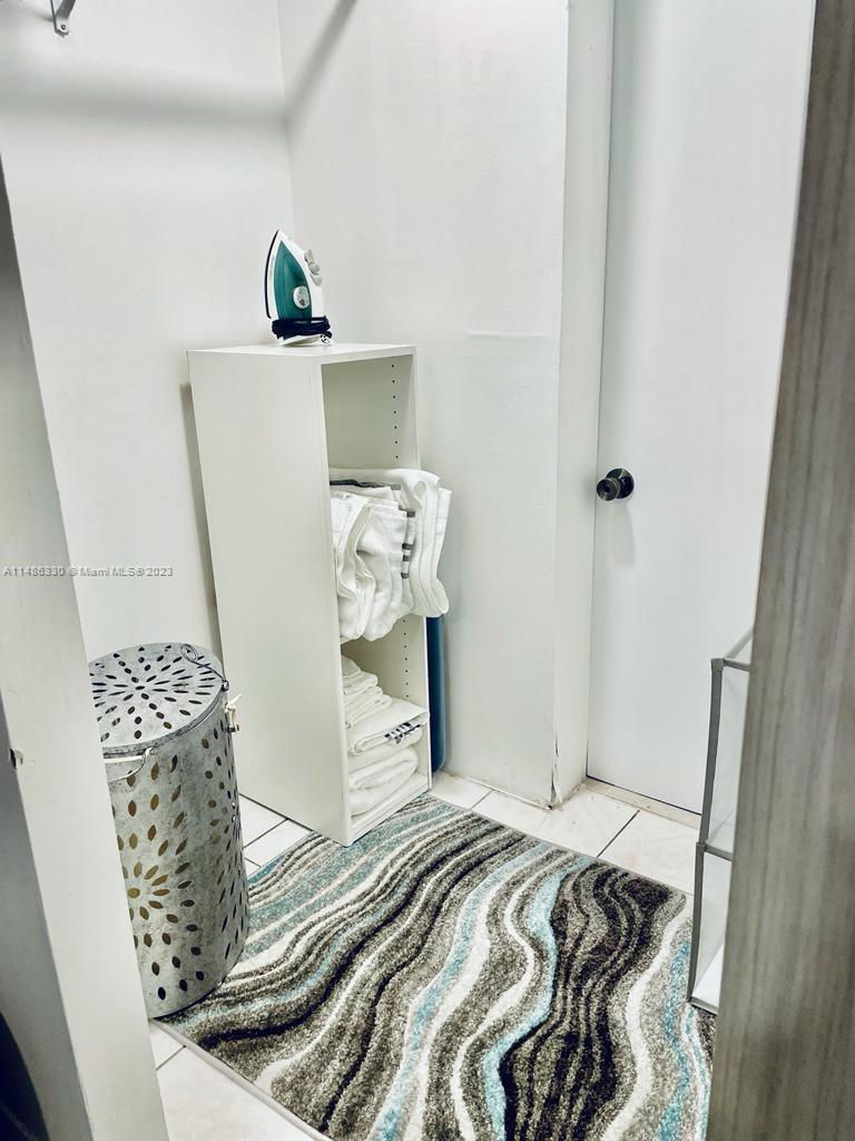 Wynwood Miami, FL 33127 - Photo 12 of 16 a bedroom with a bed and a window