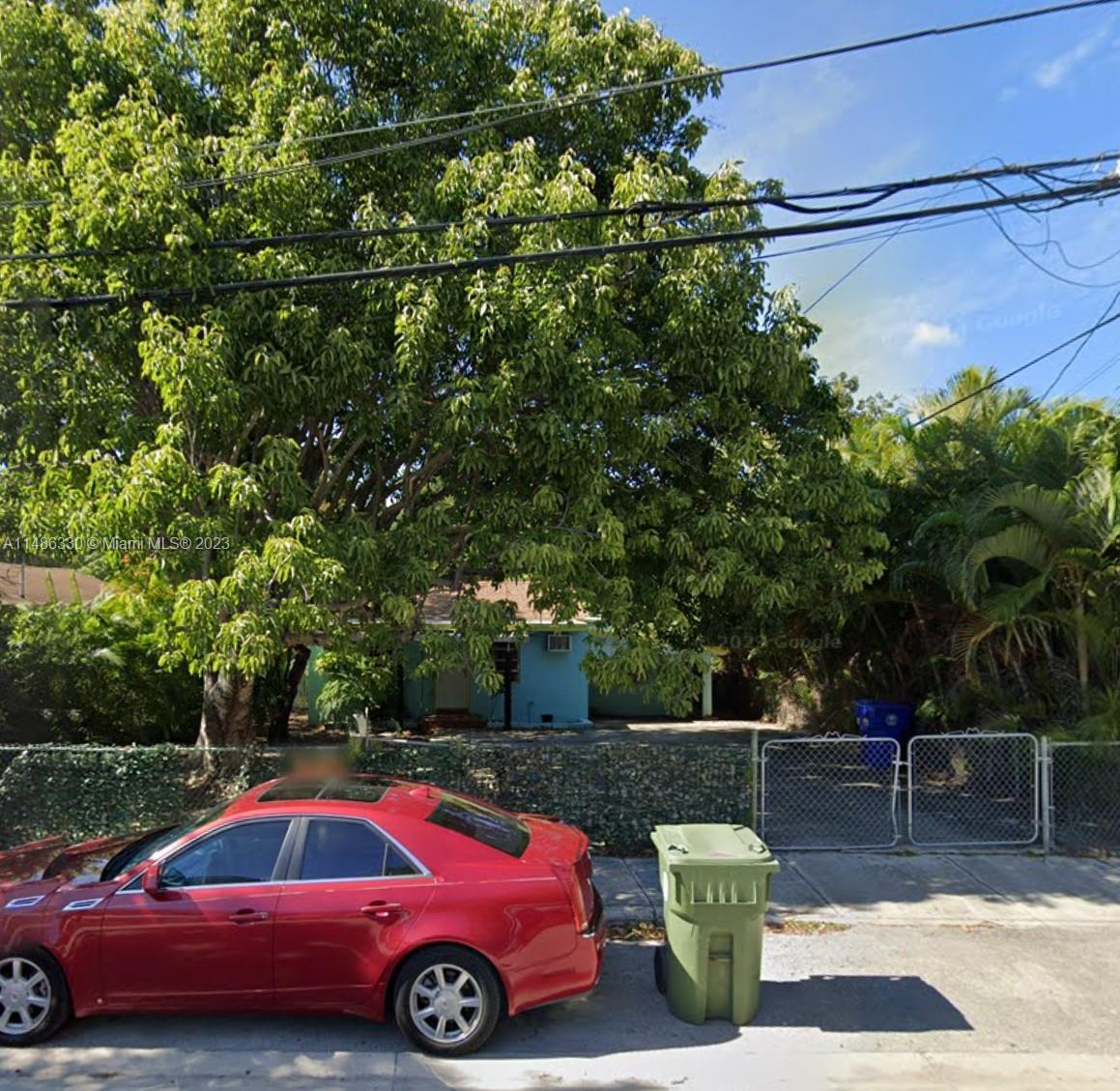 Wynwood Miami, FL 33127 - Photo 14 of 16 a front view of a yard with car parked