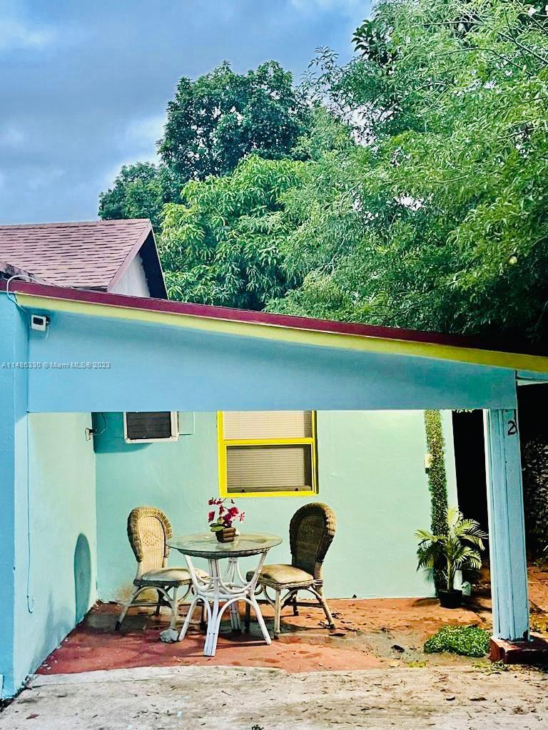 Wynwood Miami, FL 33127 - Photo 16 of 16 a backyard of a house with table and chairs