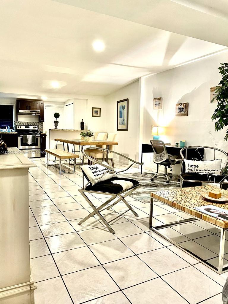 Wynwood Miami, FL 33127 - Photo 4 of 16 a living room with furniture and a table