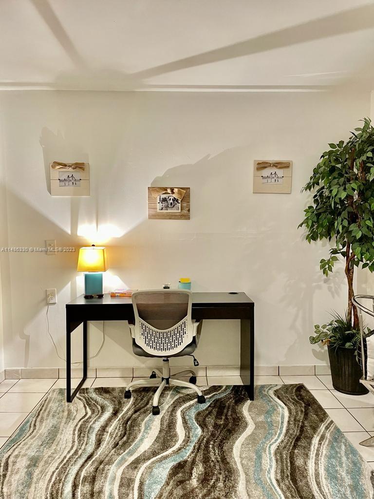 Wynwood Miami, FL 33127 - Photo 5 of 16 a room with a bed and a chair