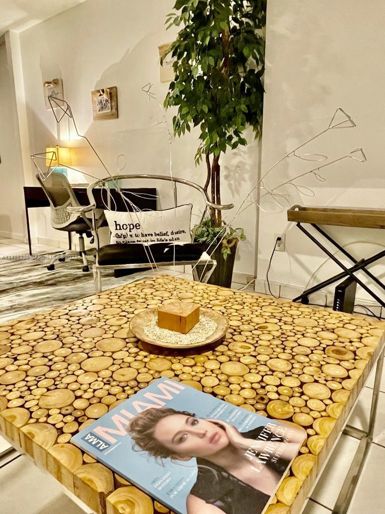 Wynwood Miami, FL 33127 - Photo 8 of 16 a bed room with a bed and a table