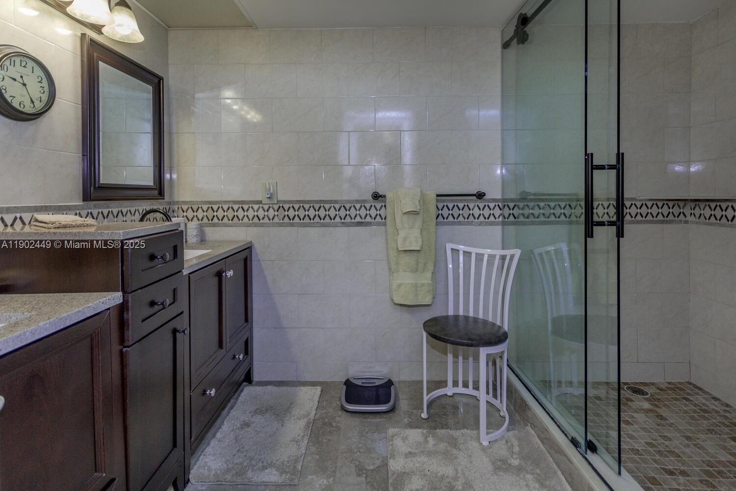 290 Celestial Way, Unit 2 Juno Beach, FL 33408 - Photo 14 of 40 a kitchen with stainless steel appliances granite countertop a sink a stove and a refrigerator