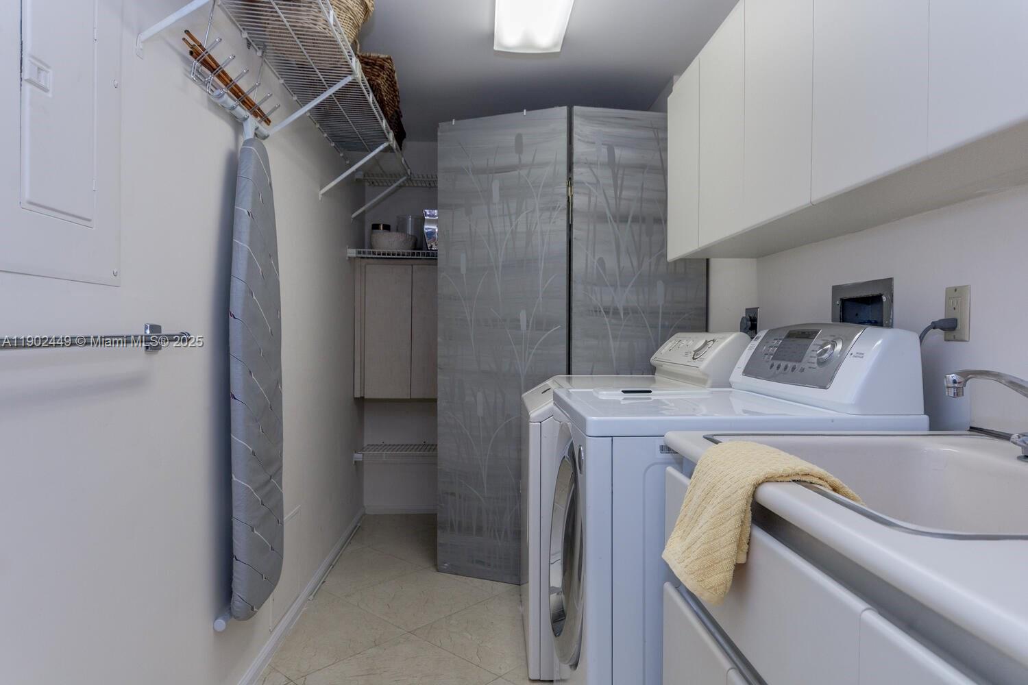 290 Celestial Way, Unit 2 Juno Beach, FL 33408 - Photo 21 of 40 a utility room with dryer and washer