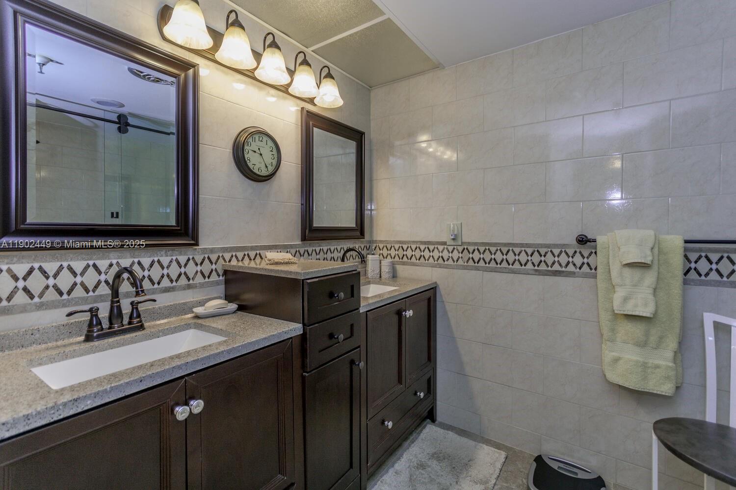 290 Celestial Way, Unit 2 Juno Beach, FL 33408 - Photo 23 of 40 a bathroom with a sink and a mirror