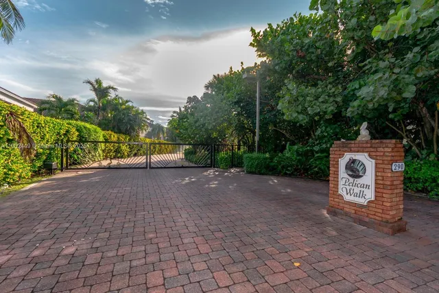a view of house with yard and green space