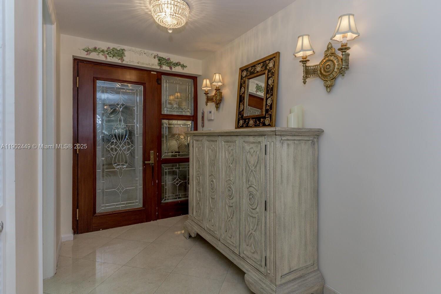 290 Celestial Way, Unit 2 Juno Beach, FL 33408 - Photo 35 of 40 a view of a hallway with wooden floor and cabinet