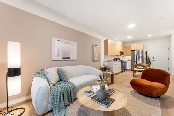 a living room with furniture and a rug