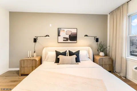 a bedroom with bed and window