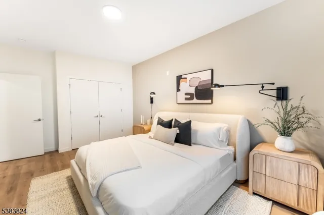 a bedroom with a bed and a couch