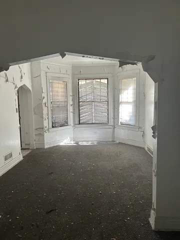 a bathroom with a sink a toilet a mirror and bathtub