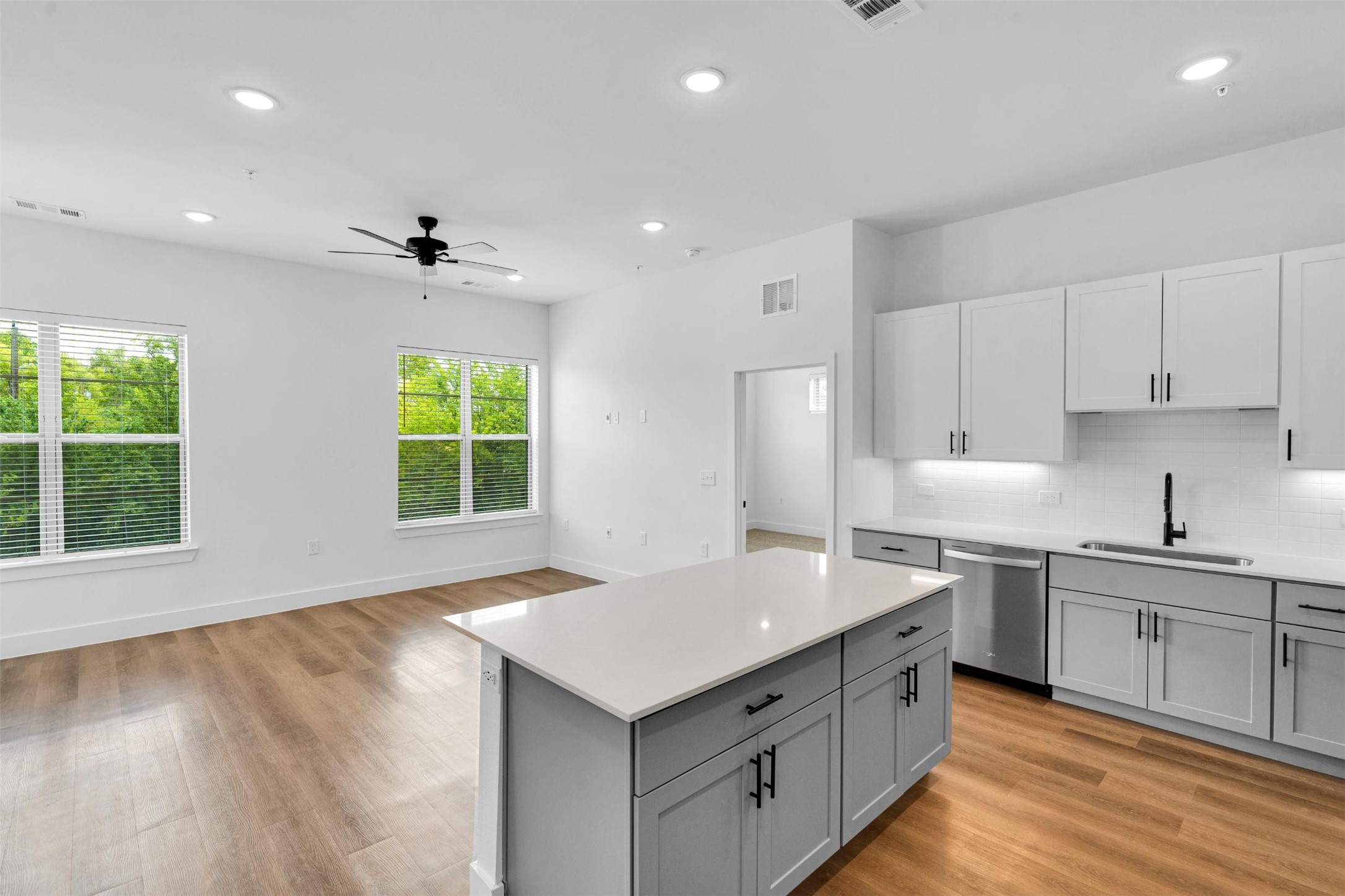 1310 A Izzy Lane Little Elm, TX 75068 - Photo 2 of 28 a kitchen with a sink stove and cabinets