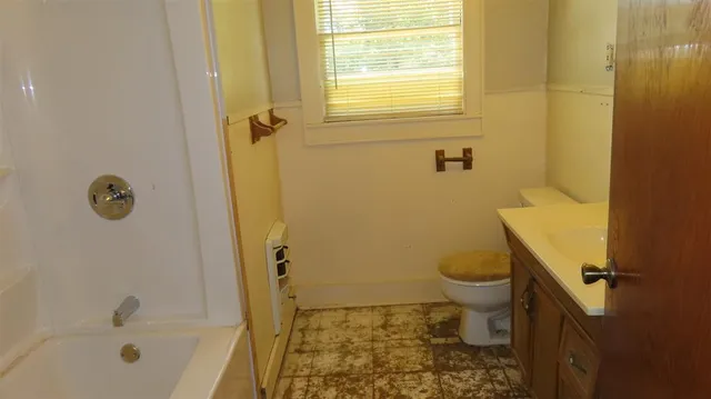 a bathroom with a sink a toilet and a bathtub