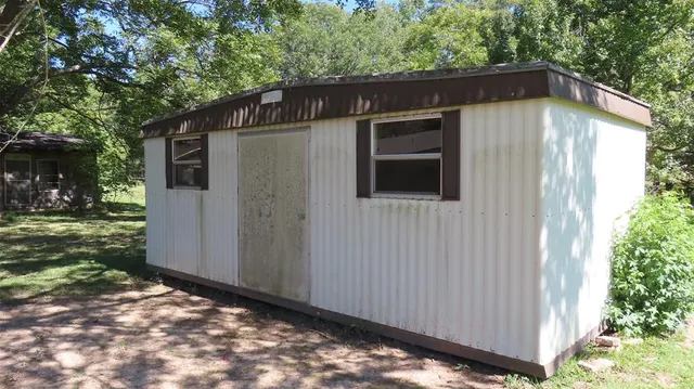 a backyard of a house with lots of green space
