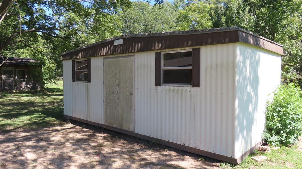 107 6th Street Northeast Springhill, LA 71075 - Photo 17 of 19 a backyard of a house with lots of green space