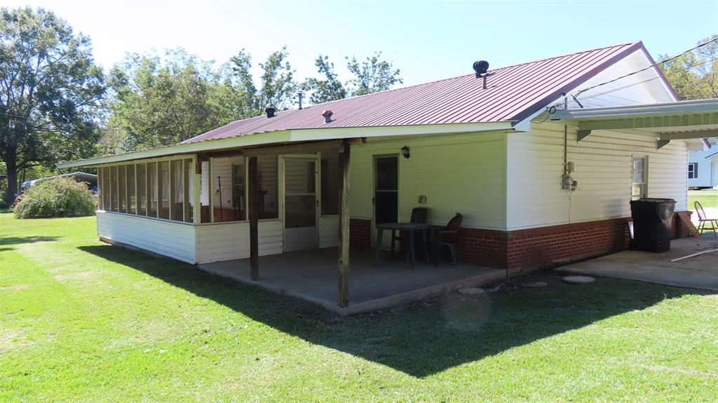 107 6th Street Northeast Springhill, LA 71075 - Photo 2 of 19 a front view of a house with garden