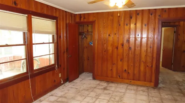 a view of an entryway with wooden floor