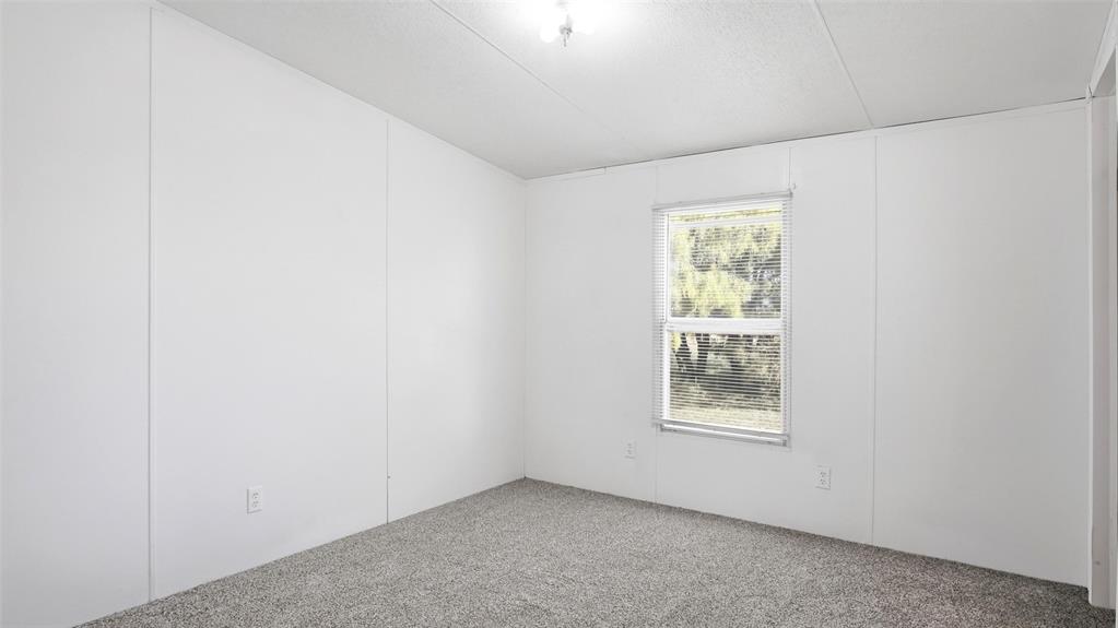 10902 County Road 414 Merkel, TX 79536 - Photo 23 of 26 an empty room with windows