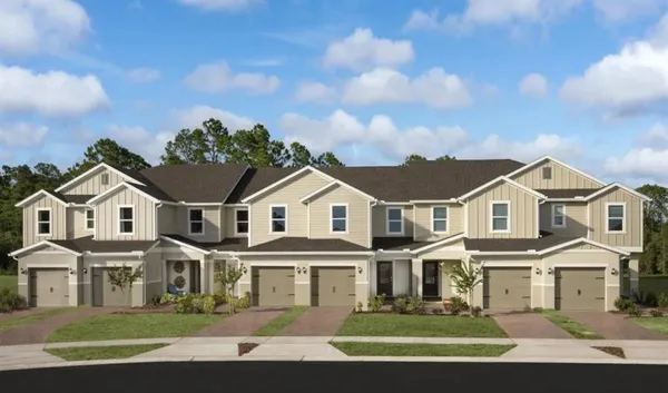 a front view of a large white house